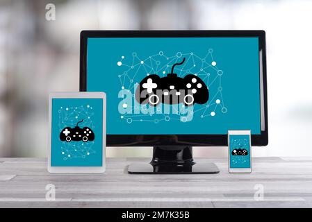 Online gaming concept shown on different information technology devices Stock Photo