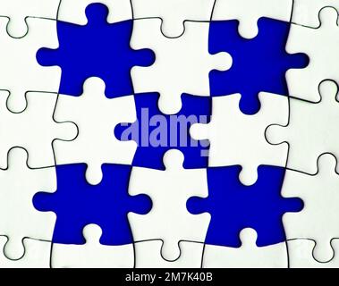 Missing jigsaw puzzle on blue background with customizable space for text or ideas. Copy space. Stock Photo