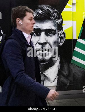London ,United Kingdom  -10/01/2023. The face of Prime Minister Rishi Sunak is seen on a poster in central London as people walk past. Stock Photo