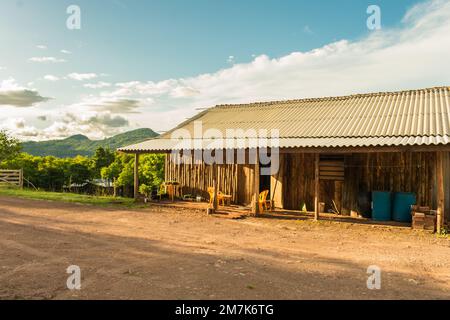 Rustic wooden house with fiber cement roofing in the countryside of Sao Francisco de Paula, Brazil Stock Photo