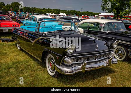 Iola, WI - July 07, 2022: High perspective front corner view of a 1955 Ford Fairlane Sunliner Convertible at a local car show. Stock Photo