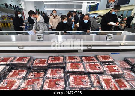 NANJING, CHINA - JANUARY 10, 2023 - People shop for New Year goods at Sam's supermarket in Nanjing, East China's Jiangsu province, Jan. 10, 2023. Stock Photo