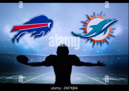 BUFFALO, USA, JANUARY 10, 2023: Miami Dolphins vs. Buffalo Bills. NFL Wild  Card Round 2023, Silhouette of NFL player of american football. holding bal  Stock Photo - Alamy