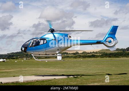 EC-120B Colibri helicopter departs Brighton City Airport Stock Photo