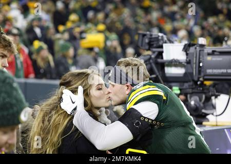 Green Bay Packers safety Dallin Leavitt (6) celebrates with teammates after  making an interception during a