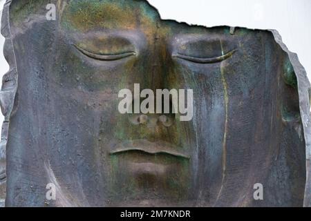 Valencia, spain - april 14, 2022: Human face in negative, cast in a metallic sculpture. Stock Photo