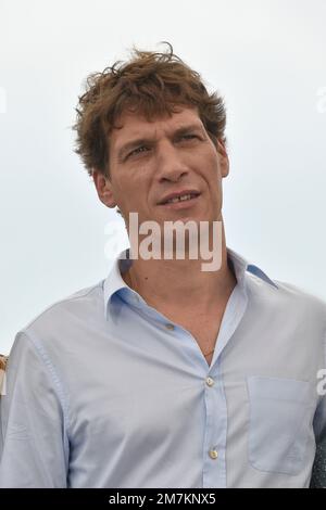Film director Cedric Jimenez posing during the photocall of the film “Novembre” on the occasion of the Cannes Film Festival on May 23, 2022 Stock Photo