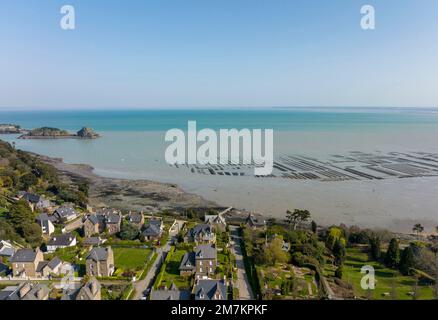 Cancale (Brittany, north-western France): aerial view of houses along the coast, oyster beds, the sea and the “pointe de la Chaine” headland on the le