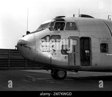 Left side view of a parked UC-123K Provider aircraft from the 315th Tactical Airlift Wing. The aircraft, being inactivated, is named 'Patches' for the more than 1,000 hit-hole patches that it received during the Vietnam conflict. The images painted on the aircraft are Snuffy Smith wearing a bullet-riddled hat and four Purple hearts, one for each aircrew member wounded in flight. Base: PHAN Rang Air Base Country: South Vietnam Stock Photo