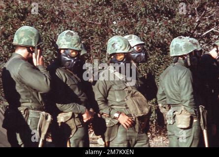 Marines wear M17 chemical-biological field masks during nuclear-biological-chemical (NBC) training. Base: Marine Corps Base Camp Pendleton State: California (CA) Country: United States Of America (USA) Stock Photo