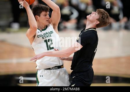 Colorado State forward Patrick Cartier left looks to pass the