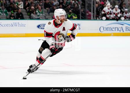 Ottawa Senators right wing Claude Giroux throws his player of the game  stick to fans following their game against the Carolina Hurricanes in an  NHL hockey game in Calgary, Alberta, Monday, April