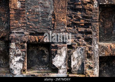 Abandoned brick wall of old damaged building closeup Stock Photo