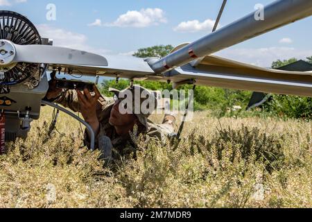 Spc. Ryan Lemon, an Unmanned Aircraft Systems Repairer assigned to the 7-17th Air Cavalry Squadron, 1st Air Cavalry Brigade readies a RQ-7B V2 Shadow during Exercise Swift Response on May 11, 2022 at Krivolak Training Area, North Macedonia. Exercise Swift Response 2022 is an annual multinational training exercise, which takes place in Eastern Europe, the Arctic High North, Baltics, and Balkans from May 2-20, 2022. It aims to present combat credible Army forces in Europe and Africa and enhance readiness by building airborne interoperability with Allies and Partners and the integration of joint Stock Photo