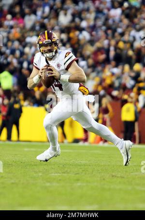 LANDOVER, MD - JANUARY 08: Commanders quarterback Sam Howell (14)  celebrates after his third quarter touchdown run during the Dallas Cowboys  versus Washington Commanders National Football League game at FedEx Field on