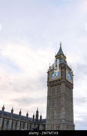 Palace of Westminster with its distinctive Tower of Big Ben at sunset and beautiful coloured sky, handheld shot. Stock Photo