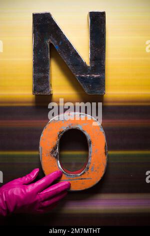 Metal letters NO on a striped background Stock Photo