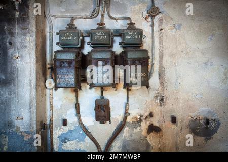 Italy, Veneto, old switches, out of order electrical system in an old industrial building Stock Photo
