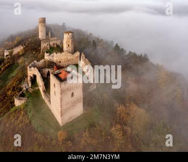 Germany, Thuringia, Gerstungen, Lauchröden, Brandenburg castle ruin rises from a sea of clouds, general view, oblique aerial view Stock Photo