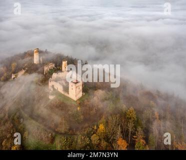 Germany, Thuringia, Gerstungen, Lauchröden, Brandenburg castle ruin rises from a sea of clouds, general view, oblique aerial view Stock Photo