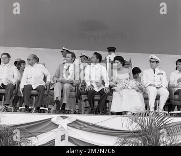 Seated during the Clark Air Force Base turnover ceremonies are from left to right, Foreign Minister of the Philippines, Carlos P. Romulo; Ambassador Richard W. Murphy; Philippine President and Mrs. Ferdinand Marcos; and Chairman of the Joint Chiefs of Staff, General David C. Jones. Base: Clark Air Base State: Luzon Country: Philippines (PHL) Stock Photo