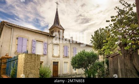 Bell tower of the Église Notre Dame in Moussan. The church was built in the XVIII century. Stock Photo