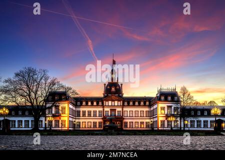 View to the sunset on illuminated the historical museum Hanau castle Philippsruhe, Hesse Germany