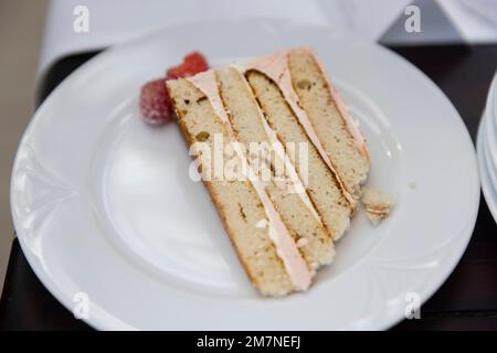 Butter cream cake served on a white plate Stock Photo