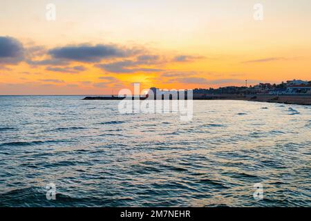 Sunset on the Spanish beach of Sitges, Catalonia, Spain. Stock Photo