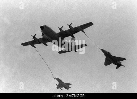 A KC-130 Hercules aircraft refuels an F-4 Phantom II aircraft, right, and an A-6 Intruder aircraft in flight. Base: Marine Corps Base, Quantico State: Virginia (VA) Country: United States Of America (USA) Stock Photo