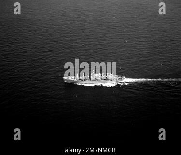 An aerial port beam view of the combat stores ship USS WHITE PLAINS (AFS-4) underway. Country: Unknown Stock Photo