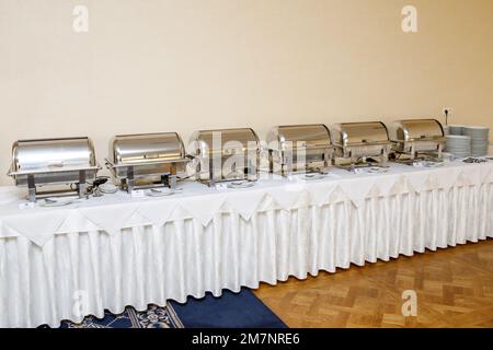 Buffet heated trays ready for service on event catering at the hotel Stock Photo