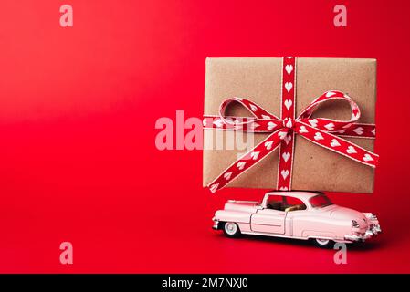 Concept - delivery of gifts for the holidays, Valentine's Day, International Women's Day, February 14, March 8. Shopping, sale Stock Photo