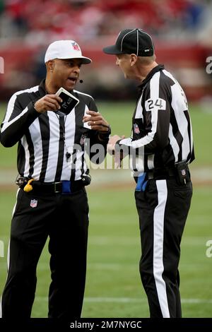 Referee Adrian Hill (29) watches a replay in the first half of an