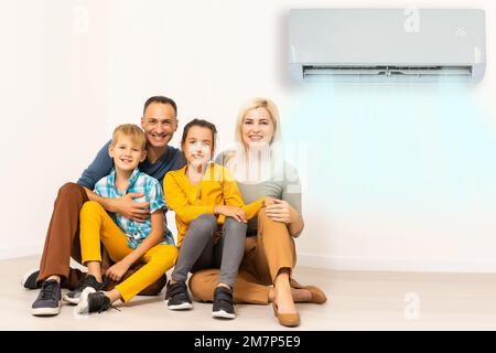 Happy Family Under Air Conditioning Stock Photo