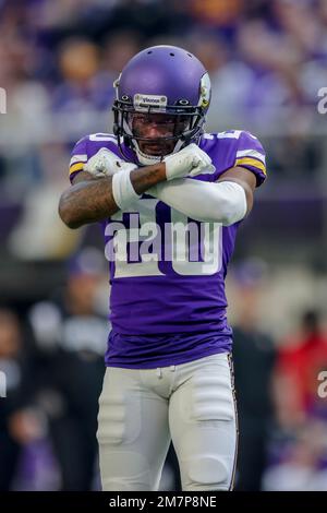 Minnesota Vikings cornerback Duke Shelley (20) greets safety Harrison Smith  (22) during the first half of