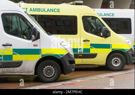 London, UK, 10 January 2023: At Kings College Hospital, London, a Unison placard asks for people to support striking ambulance workers. Inside the hospital grounds, transport ambulances are parked in a row. Anna Watson/Alamy Live News Stock Photo