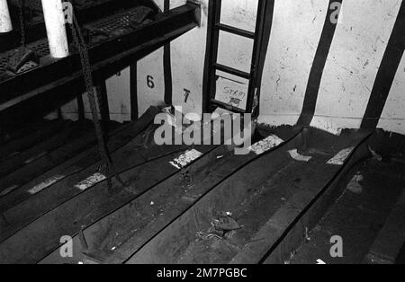 An interior view of damage caused to the aircraft carrier USS MIDWAY (CV41) when it collided with the Panamanian freighter CACTUS. Base: Naval Station, Subic Bay State: Luzon Country: Philippines (PHL) Stock Photo