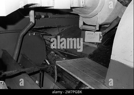 An interior view of damage caused to the aircraft carrier USS MIDWAY (CV41) in a collision with the Panamanian freighter CACTUS. Base: Naval Station, Subic Bay State: Luzon Country: Philippines (PHL) Stock Photo