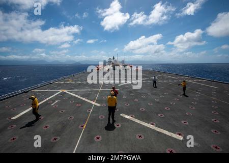 PACIFIC OCEAN (May 11, 2022) – U.S. Navy Sailors prepare for routine flight operations on the flight deck aboard Military Sealift Command hospital ship USNS Mercy (T-AH 19) while underway for Pacific Partnership 2022. Now in its 17th year, Pacific Partnership is the largest annual multinational humanitarian assistance and disaster relief preparedness mission conducted in the Indo-Pacific. Stock Photo