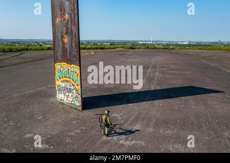 Sculpture Bramme for the Ruhr Area by Richard Serra, on the Brammentrail, mountain bike trail on the Schurenbach slagheap, in Essen NRW, Germany, Stock Photo