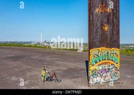 Sculpture Bramme for the Ruhr Area by Richard Serra, on the Brammentrail, mountain bike trail on the Schurenbach slagheap, in Essen NRW, Germany, Stock Photo