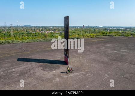 Sculpture Bramme for the Ruhr Area by Richard Serra, on the Brammentrail, mountain bike trail on the Schurenbach slagheap, in Essen NRW, Germany, Stock Photo