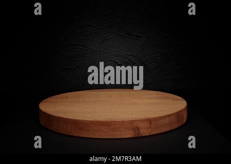 Wooden podium or pedestal display on dark background with cylinder stand concept. Blank product shelf standing backdrop Stock Photo