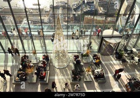 Visitors in the Sky Garden Cafe overlooking the River Thames, on the top of 20 Fenchurch Street, London, UK.  London's highest public garden. Stock Photo