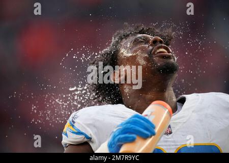 Los Angeles Chargers defensive tackle Sebastian Joseph-Day (69) and  linebacker Troy Reeder (42) tackle Seattle Seahawks quarterback Sean  Mannion (9) in the end zone for a safety during the second half of