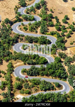 Aerial view of a curved road, car, red Stock Photo