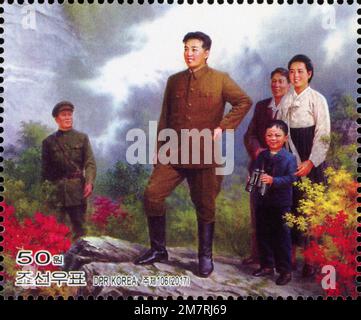 2017 North Korean stamp. Painting of Kim Il Sung with family visit liberated Mount Kumgang Stock Photo