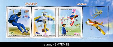 2016 North Korea postage stamp set featuring air sports, including parachuting and radio-controlled model airplanes. Stock Photo