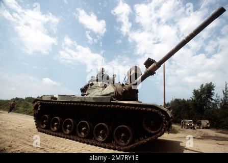 AN M-60 aggressor forces tank group maneuvers through the field during ...